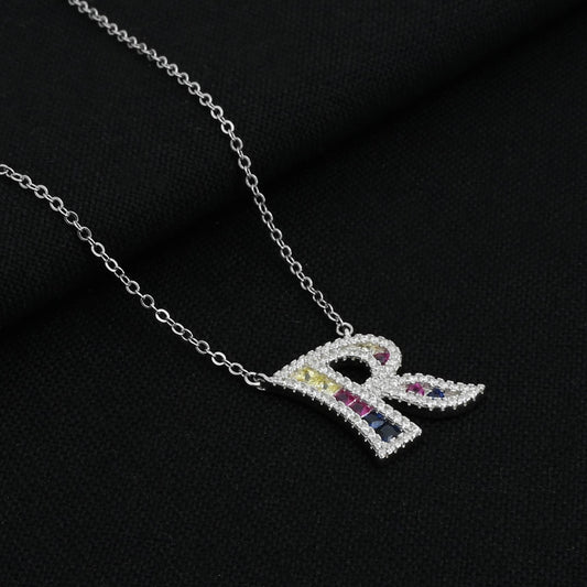 Silver necklace featuring a personalized 'R' symbol pendant.