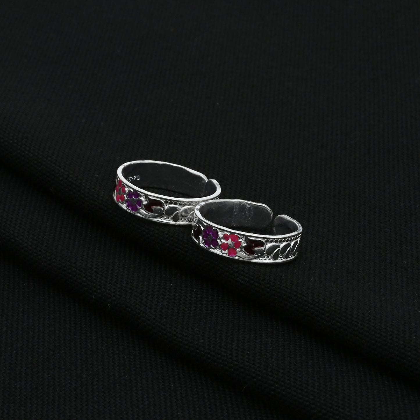 Charming silver toe rings with colorful floral accents, perfect for adding a pop of color