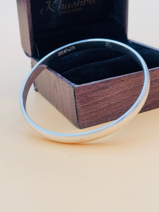 Elegant plain silver kada designed specifically for boys.