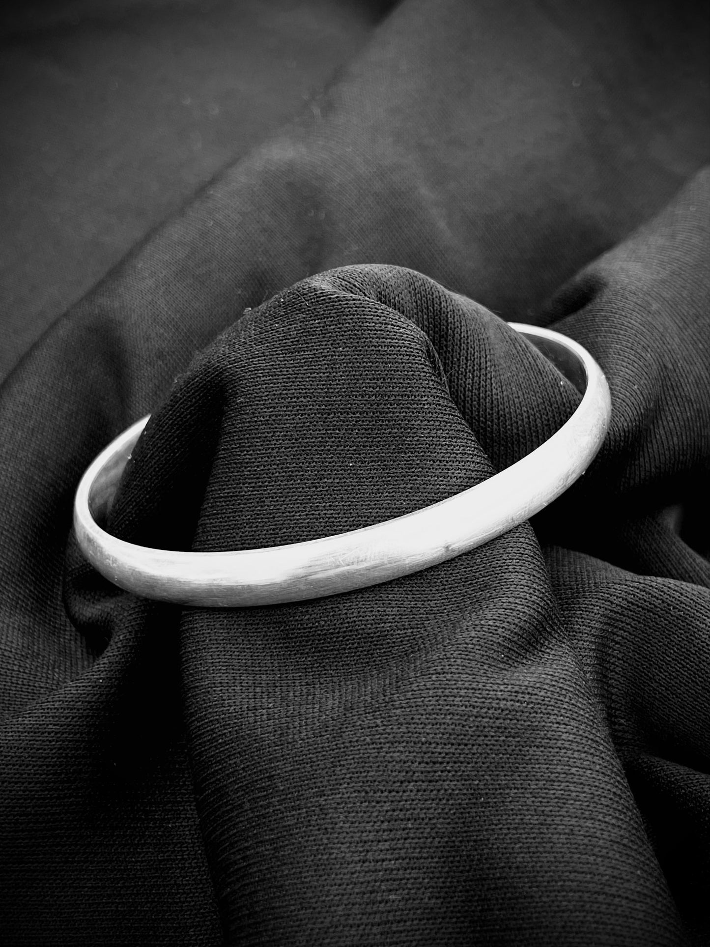 Minimalist plain silver kada with a modern design for boys.