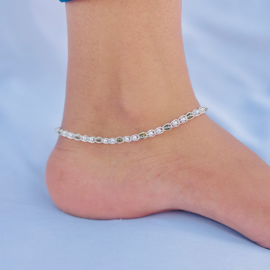 Designer silver payal with green and silver beads for a chic look