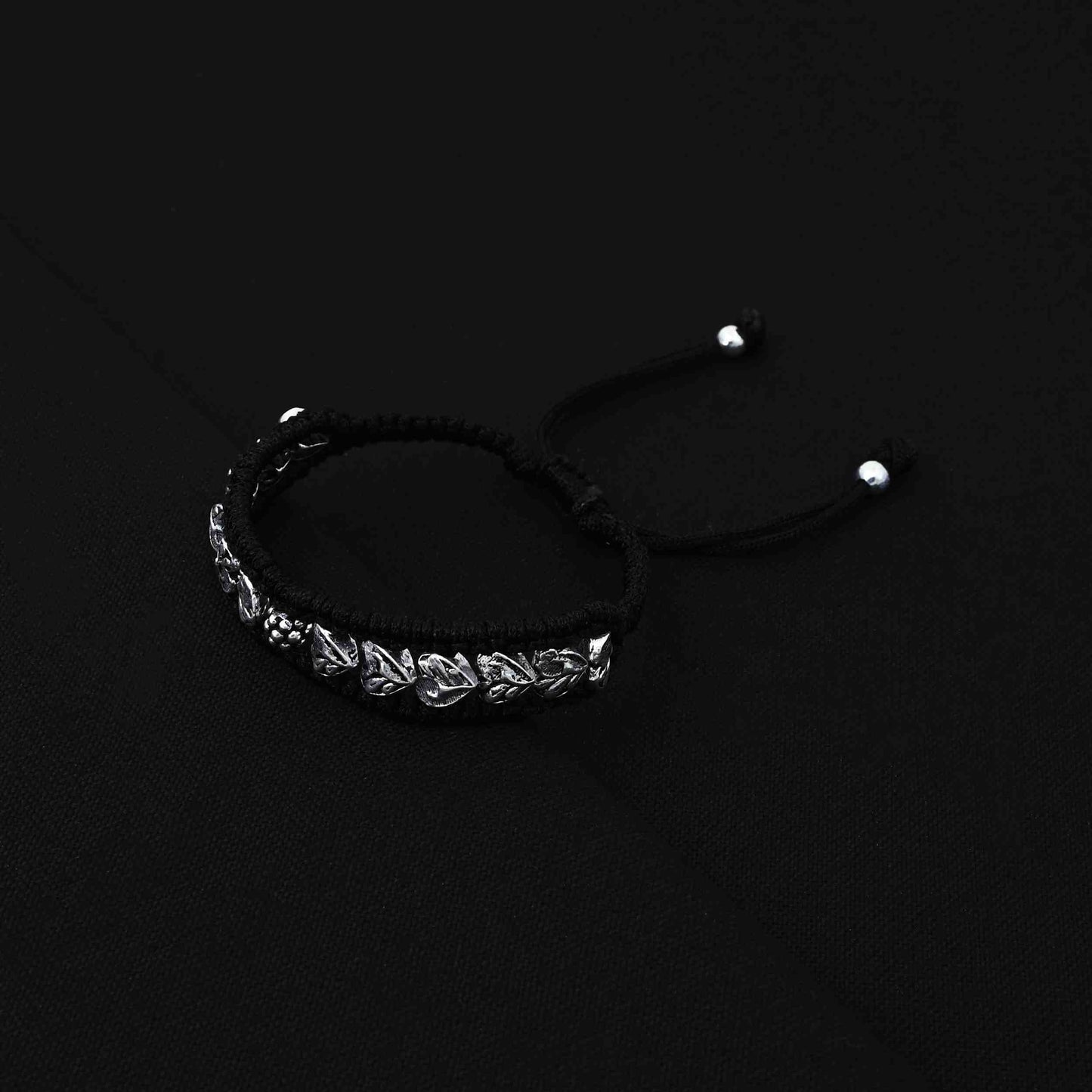 Trendy silver bracelet for boys with a leaves design and subtle silver beads