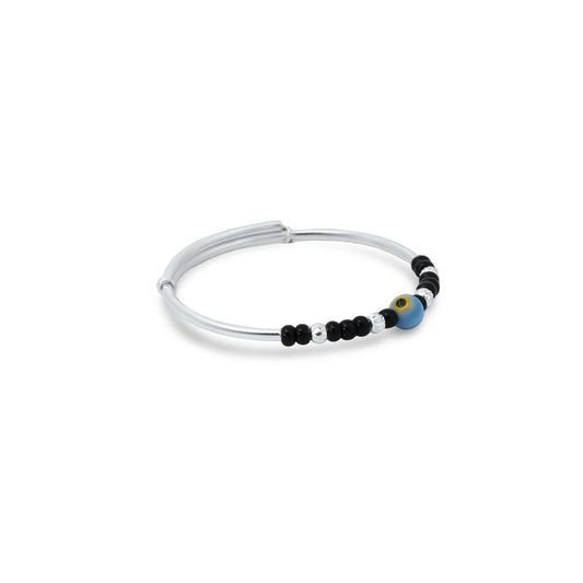 Cute silver kada anklet for babies, adorned with a blue and yellow evil eye and black and silver bead accents