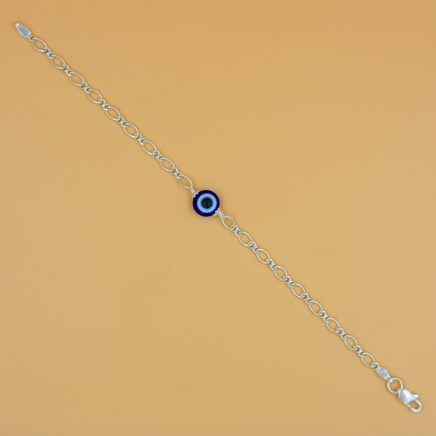 Delicate sterling silver bracelet with a protective evil eye charm