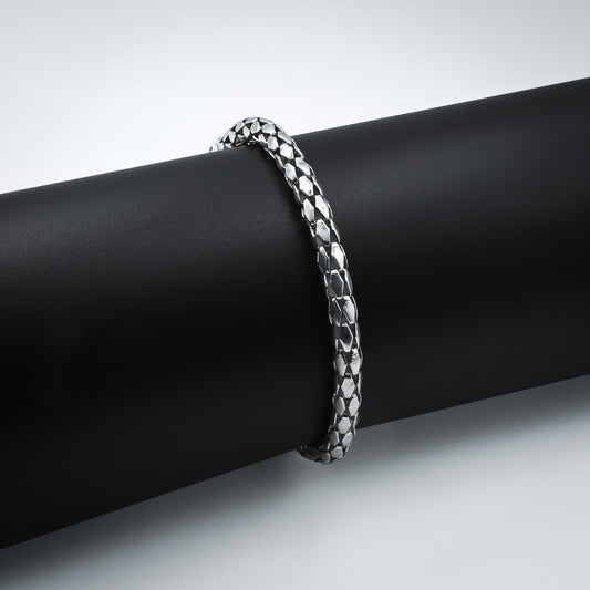 Stylish silver bracelet featuring an elegant textured pattern