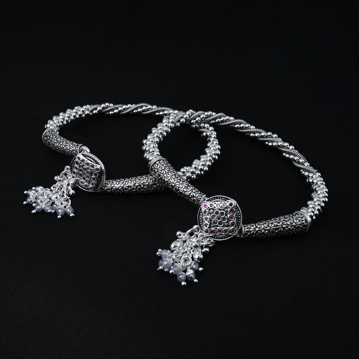 Silver kada payal adorned with detailed floral patterns