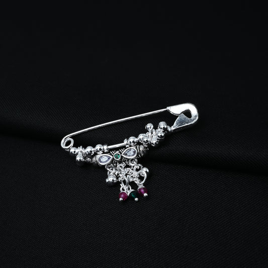 Elegant silver saree pin featuring teardrop-shaped stones