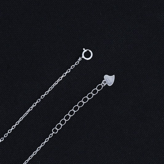 Stylish silver pendant showcasing a sleek black heart design