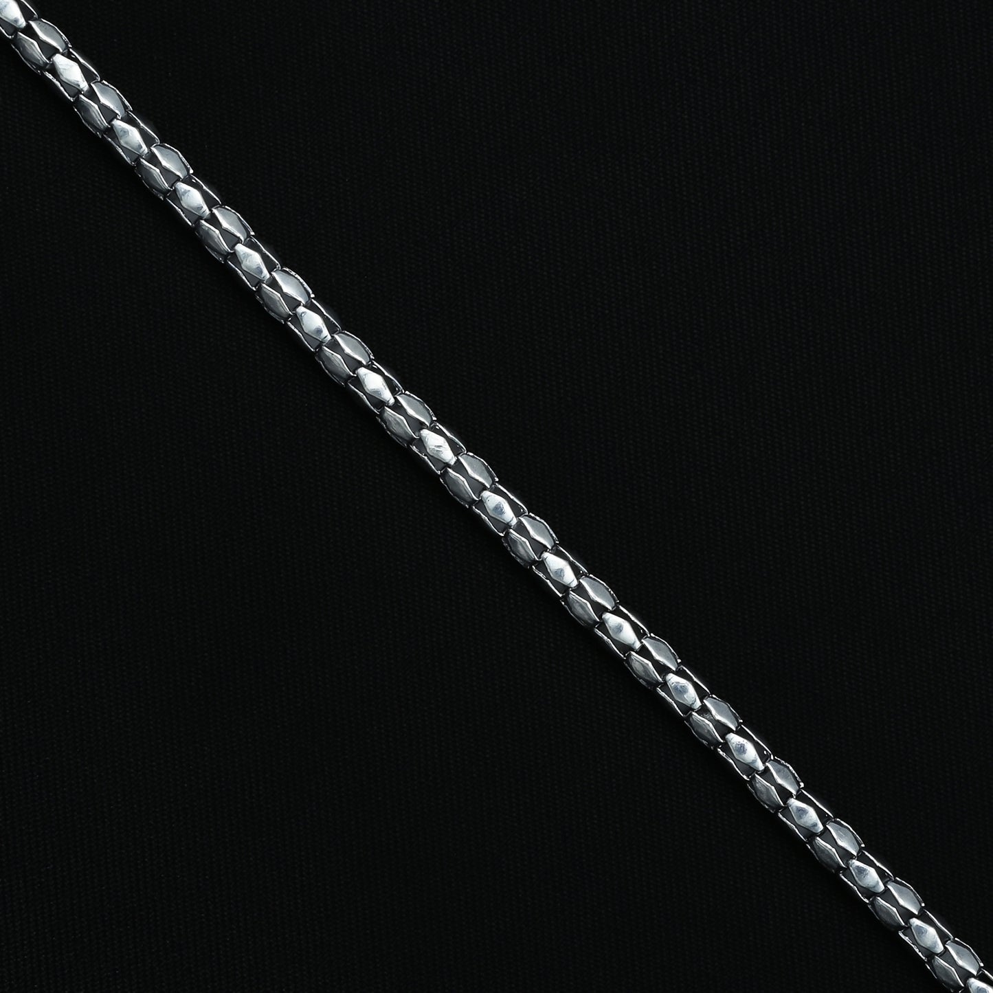 Minimalistic sterling silver bracelet with distinctive textured detailing