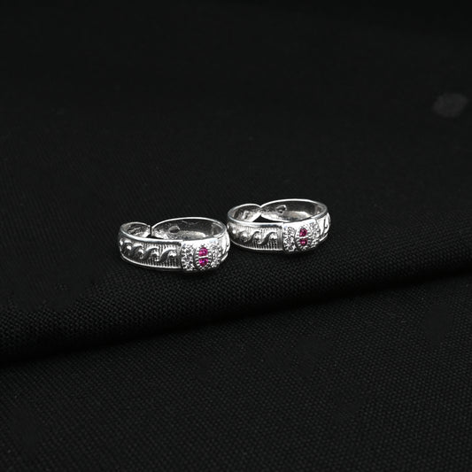 Silver Toe Ring with Intricate Detailing and Pink Stone