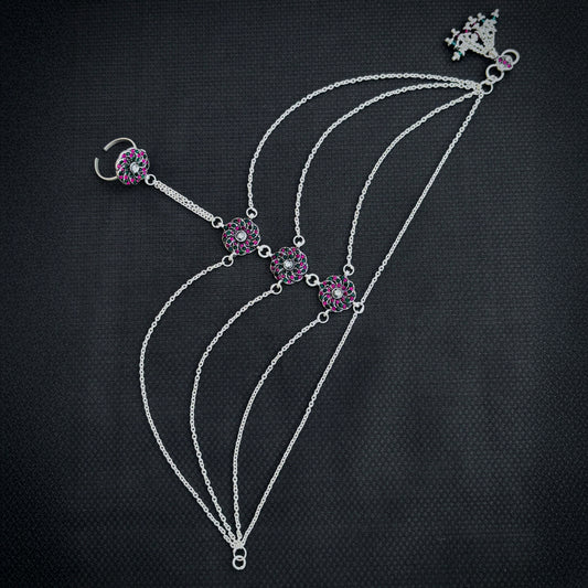 Elegant chain silver payal featuring a floral design and stones.