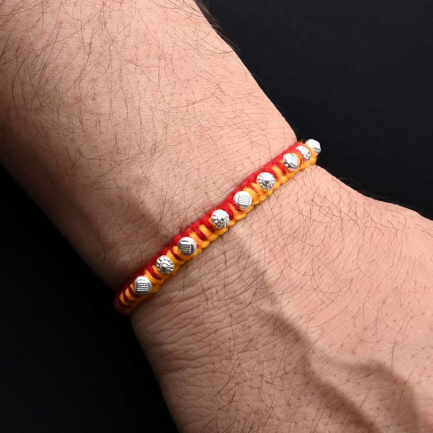 Elegant Rakhi with a distinctive silver beads pattern, ideal for boys