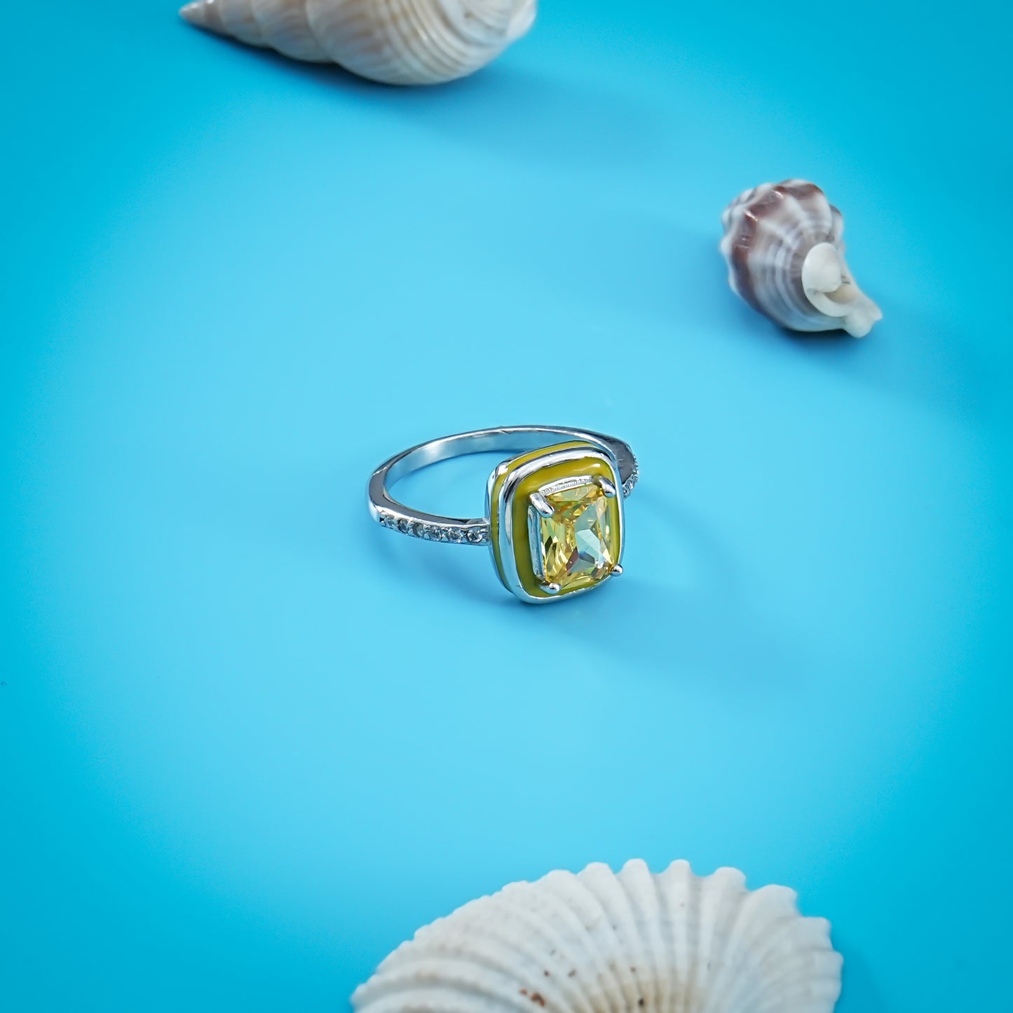 Stylish silver ring with a large yellow rectangular gemstone for a unique statement