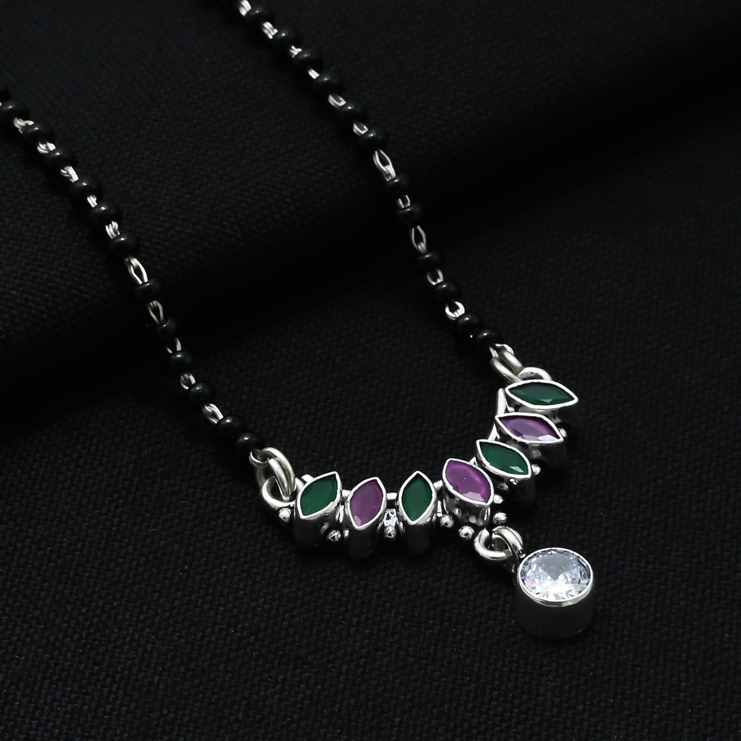Chic sterling silver mangalsutra adorned with green and purple leaf-shaped gemstones