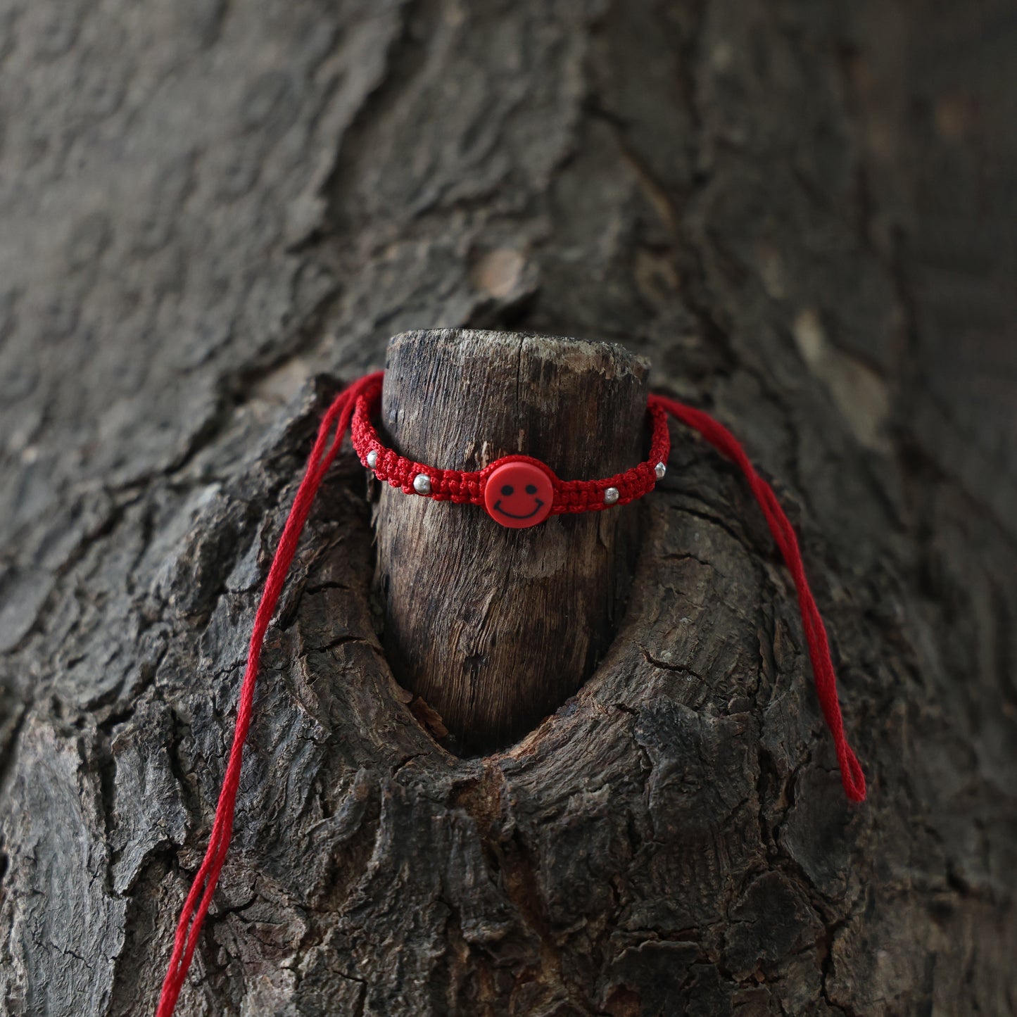 Joyful Red Smiley Rakhi in Silver