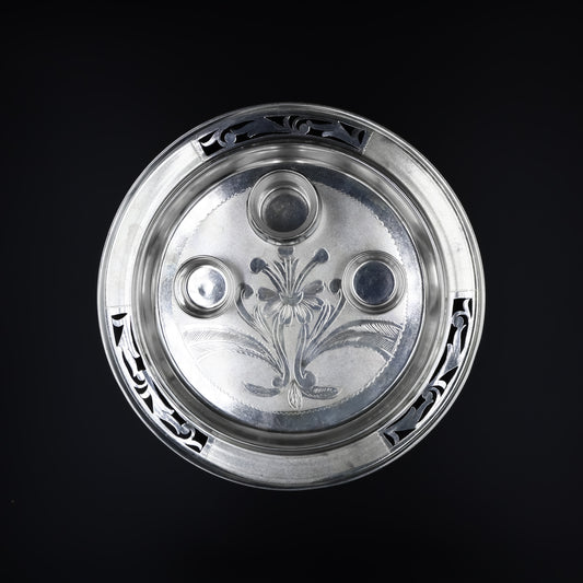 Close-up of the intricately crafted silver pooja thali set, designed for use in religious ceremonies