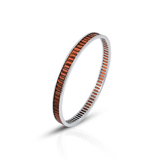 Elegant silver bangles featuring vibrant orange stone accents
