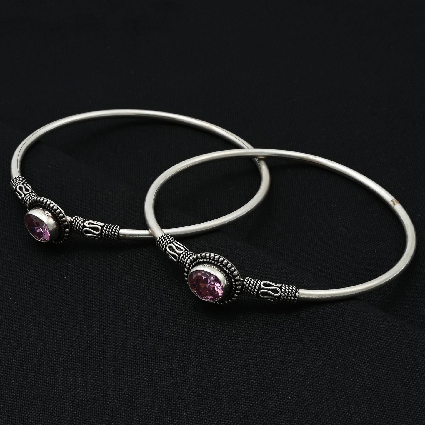 Beautiful silver kada payal featuring sparkling authentic ruby pink gemstones.