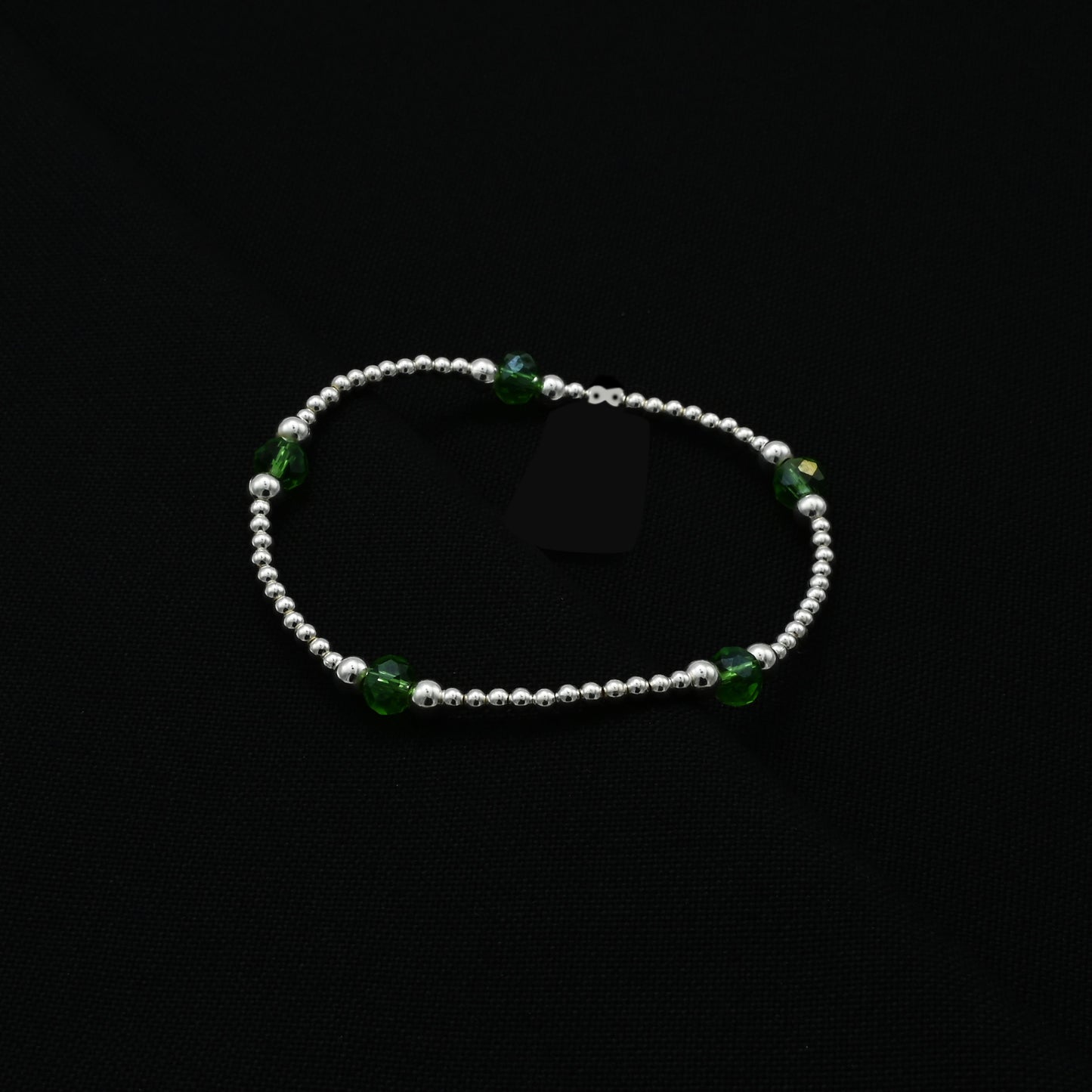 Charming silver bracelet for girls with a bold green bead design