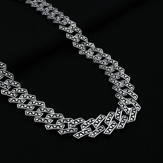 Stylish silver Cuban chain with angular pattern for men.
