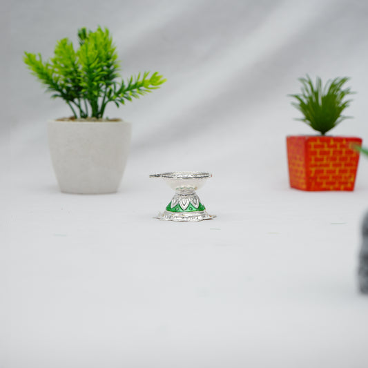 Elegant silver deepak, adding a sacred touch to your pooja with its detailed craftsmanship.