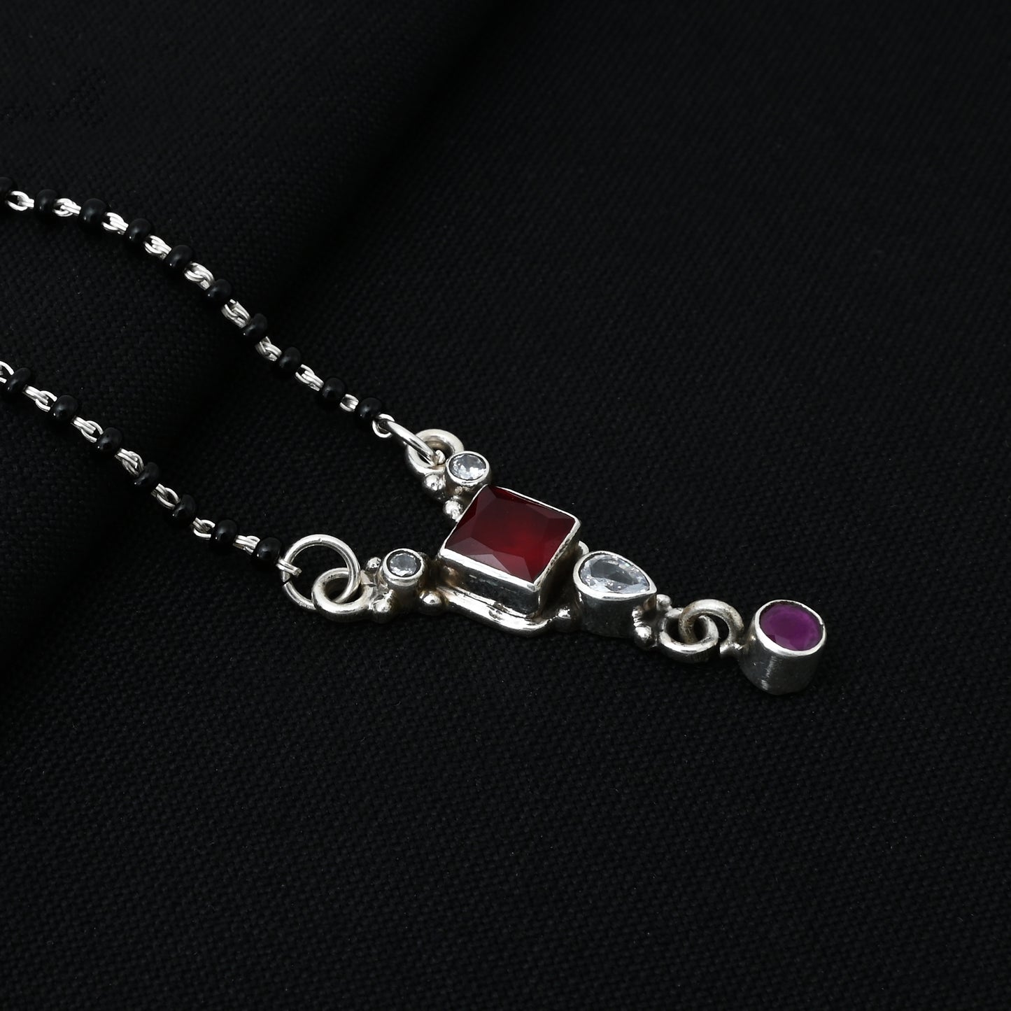 Timeless silver mangalsutra adorned with a radiant square red stone