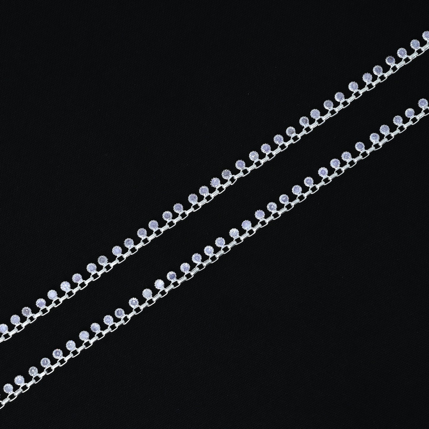 Charming silver anklet showcasing purple gemstones and a kadi connection design, ideal for a graceful and trendy appeal