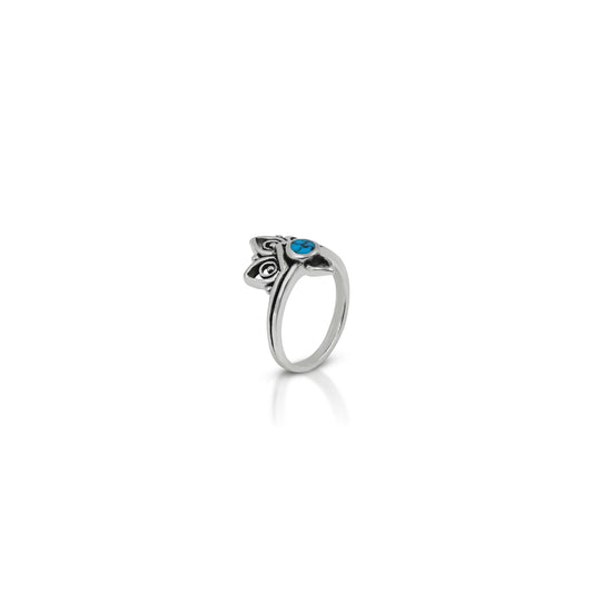 Beautifully crafted sterling silver ring adorned with a turquoise gemstone and intricate flower motifs.