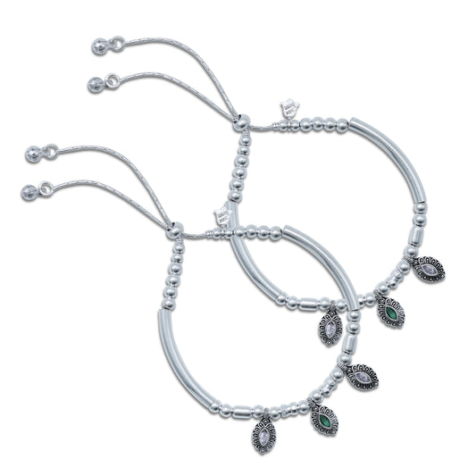 Charming beaded anklet featuring green and white gemstones on a silver chain