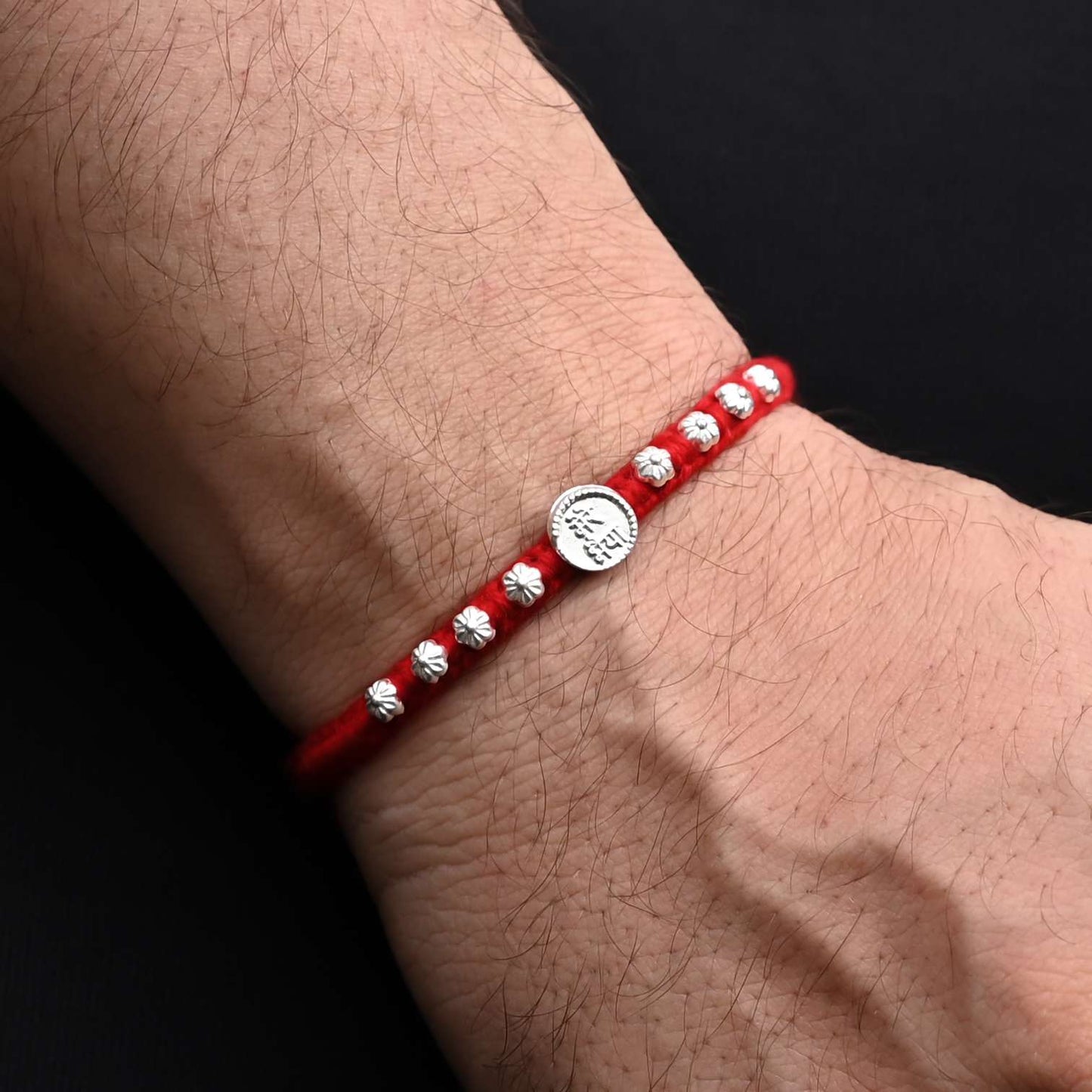 Traditional Rakhi with 'Mere Bhaiya' written in silver and adorned with a floral design, ideal for boys