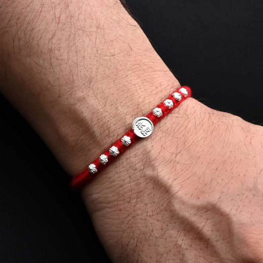 Traditional Rakhi with 'Mere Bhaiya' written in silver and adorned with a floral design, ideal for boys
