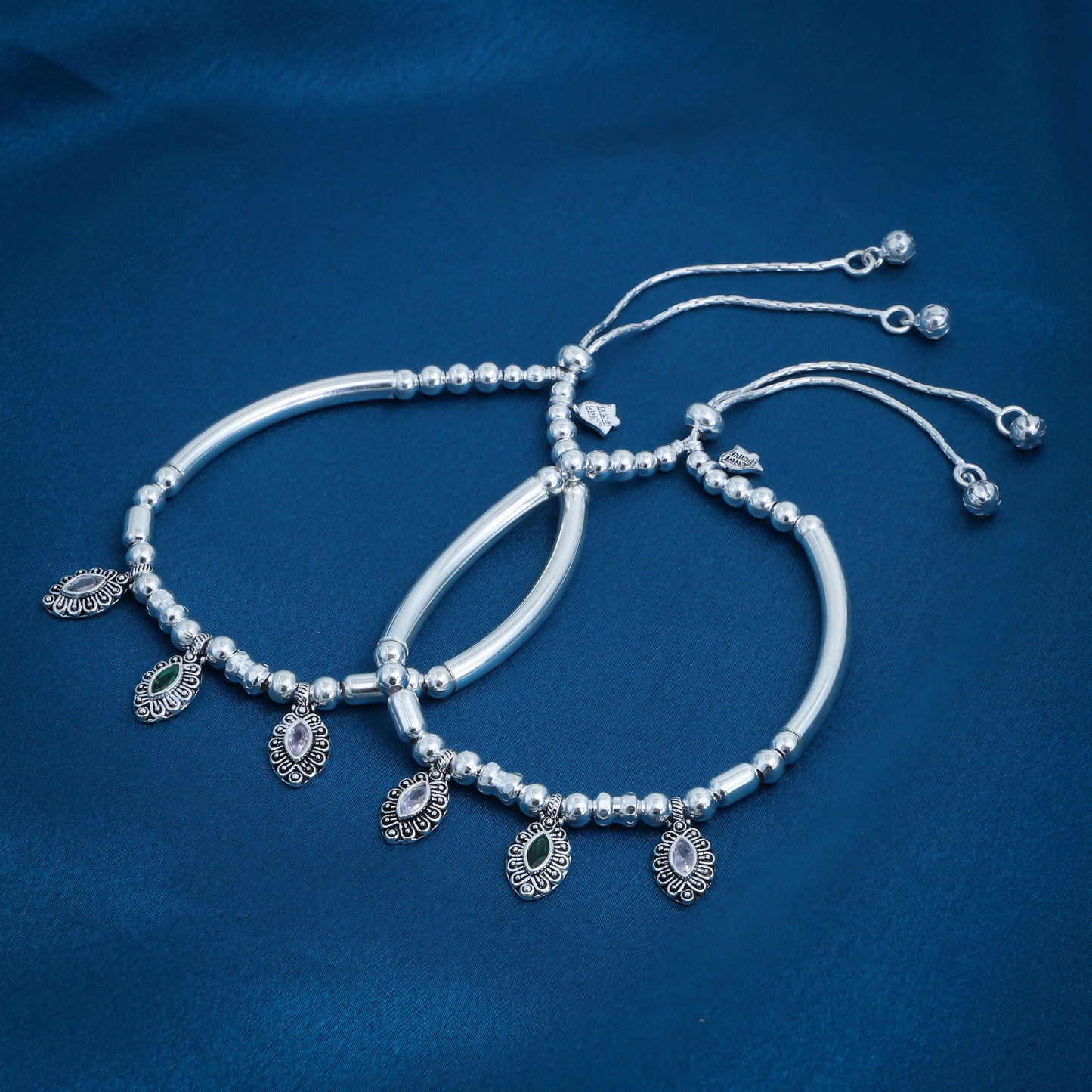 Elegant silver anklet embellished with green and white gemstone accents