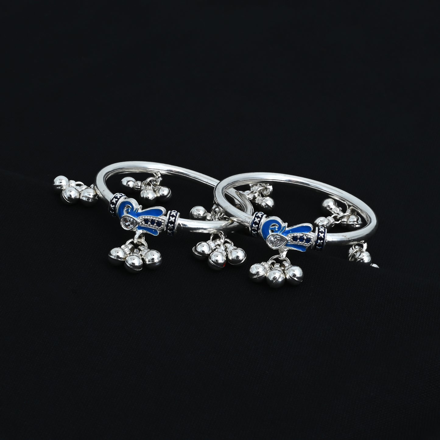 Silver kada payal for babies, designed with a blue peacock and ghungroo details.