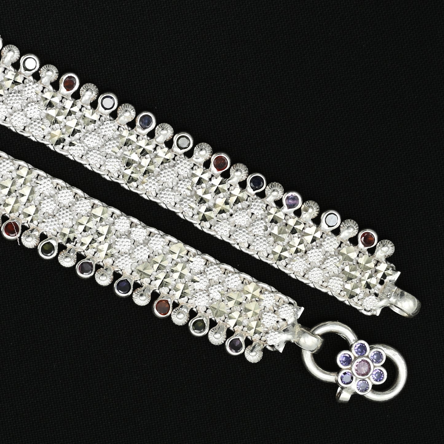 Silver anklet with a shiny finish and a sleek modern pattern