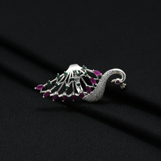 Close-up of a silver ring with a peacock motif, offering a vibrant and graceful look for girls