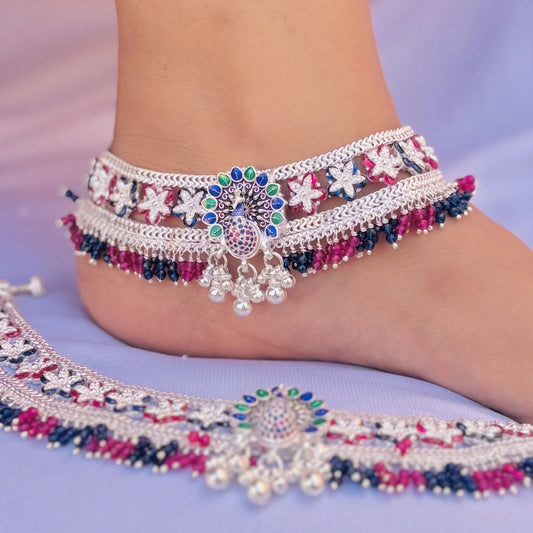 Sophisticated silver payal with intricate peacock and flower designs, perfect for a traditional style