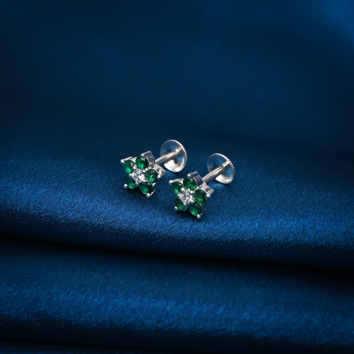 Stunning green stone earrings with a flower design in sterling silver