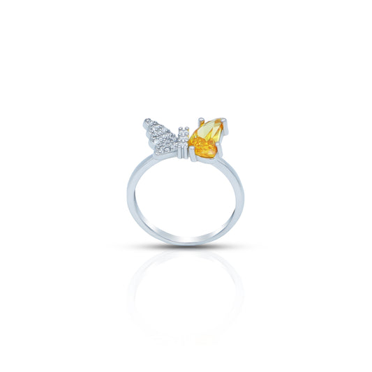 Butterfly-shaped silver ring featuring a yellow stone