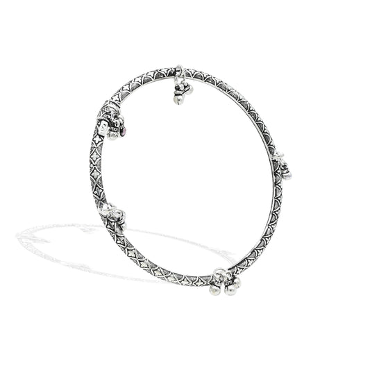 Elegant silver kada anklet for girls with vintage bell accents for a classic touch.