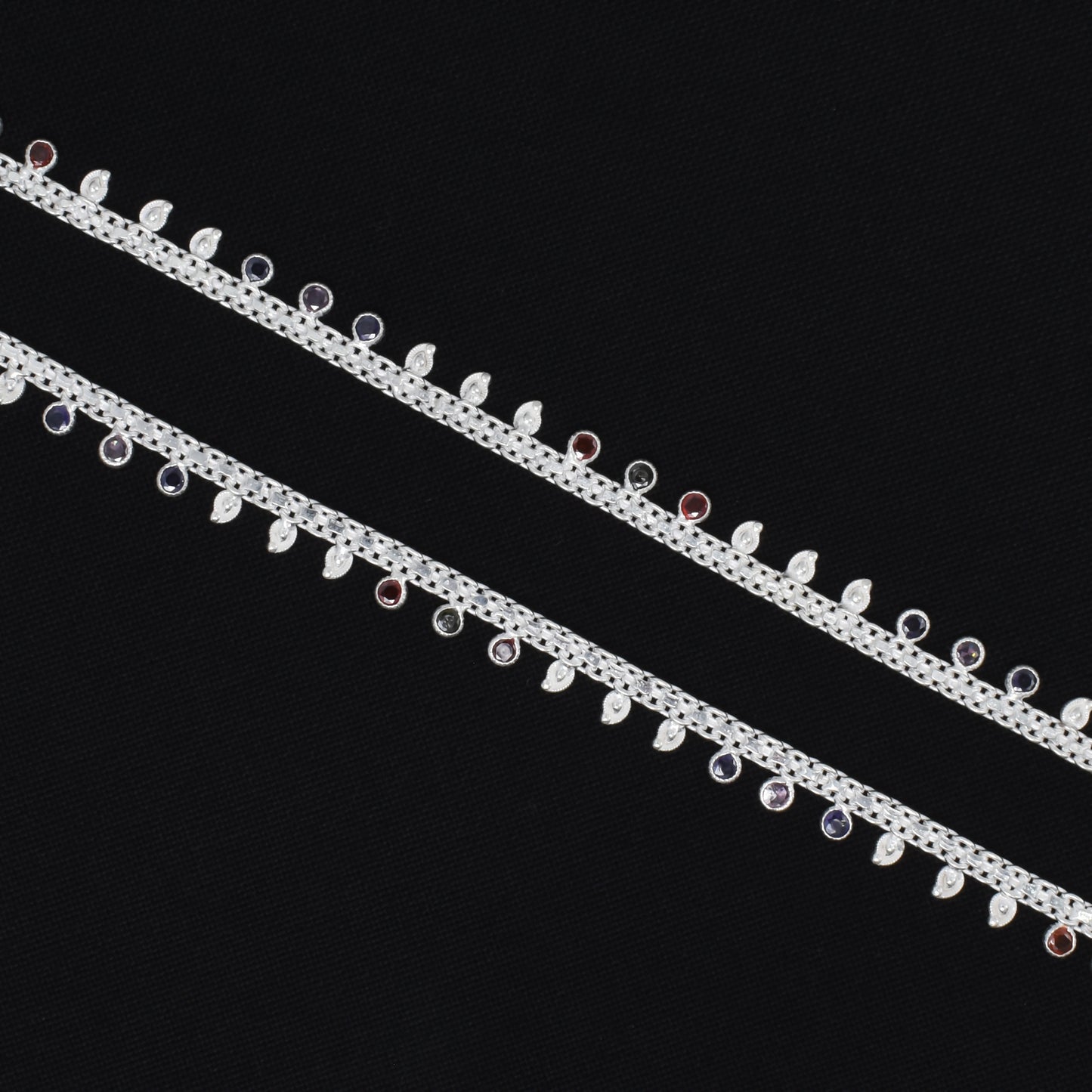 Charming silver anklet showcasing vibrant multicolored stones for a festive and stylish appeal