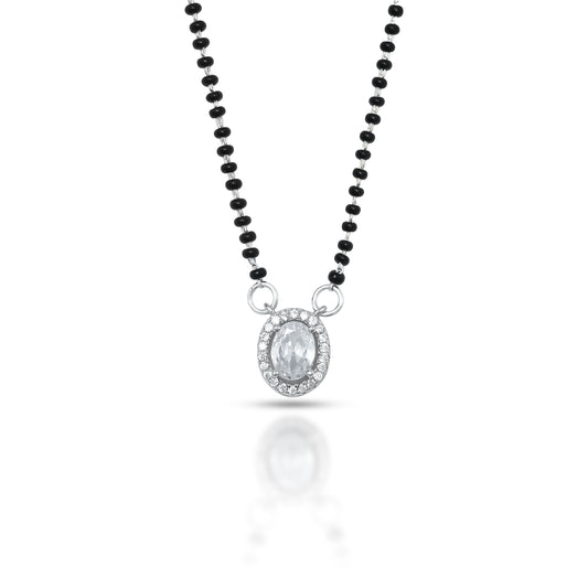 Stylish silver mangalsutra featuring an oval gemstone centerpiece