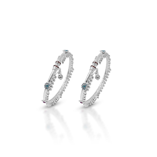 Elegant silver payal featuring striking red and blue stone accents