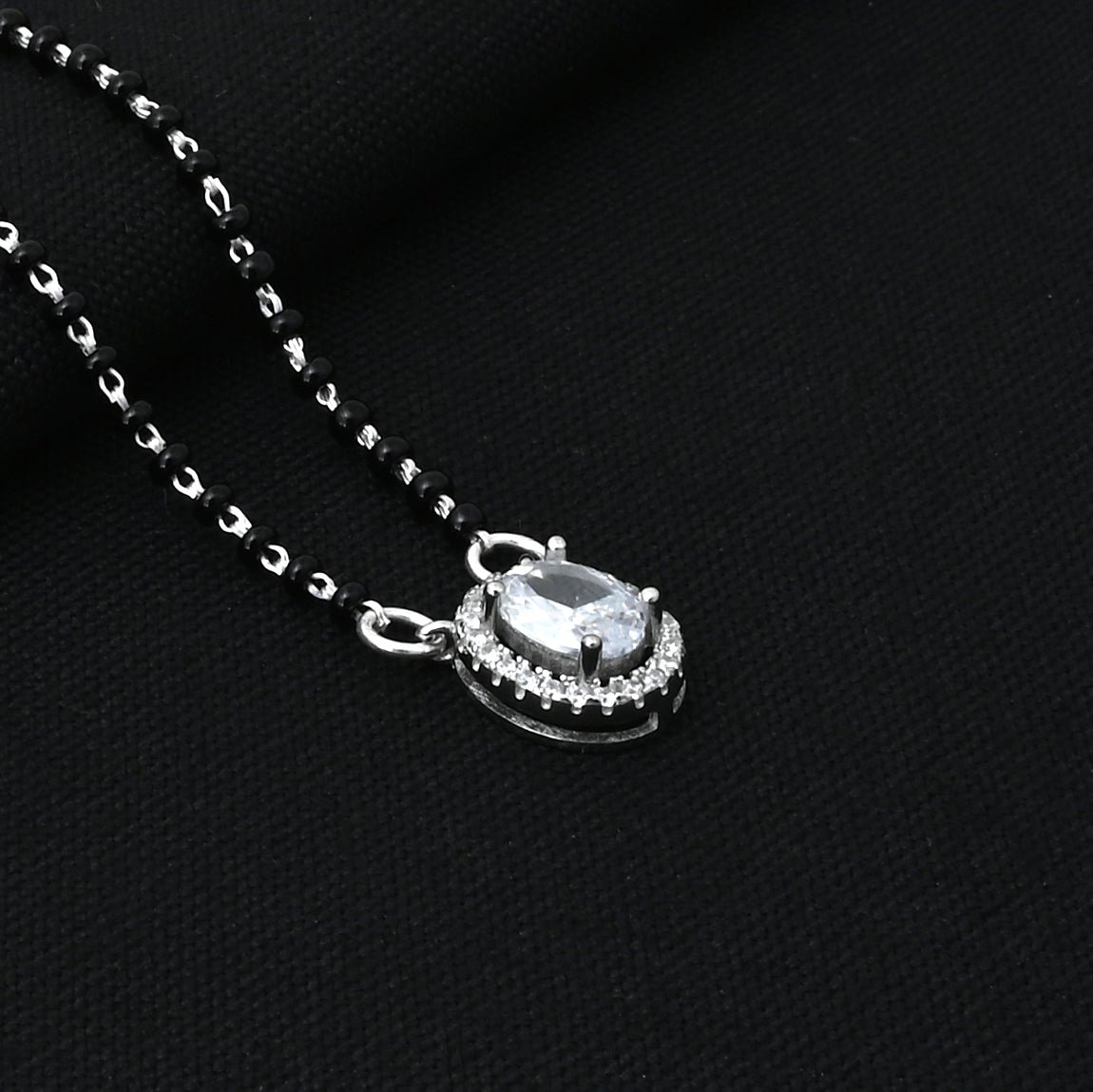 Handcrafted silver mangalsutra with oval gemstone, perfect for traditional occasions