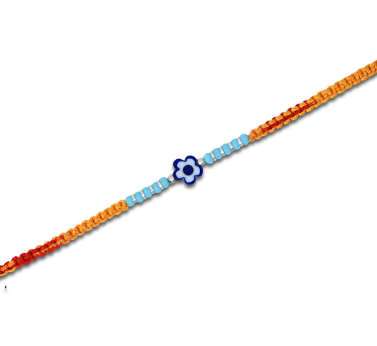 Boys' Rakhi featuring a silver blue flower centerpiece and light blue, silver beads