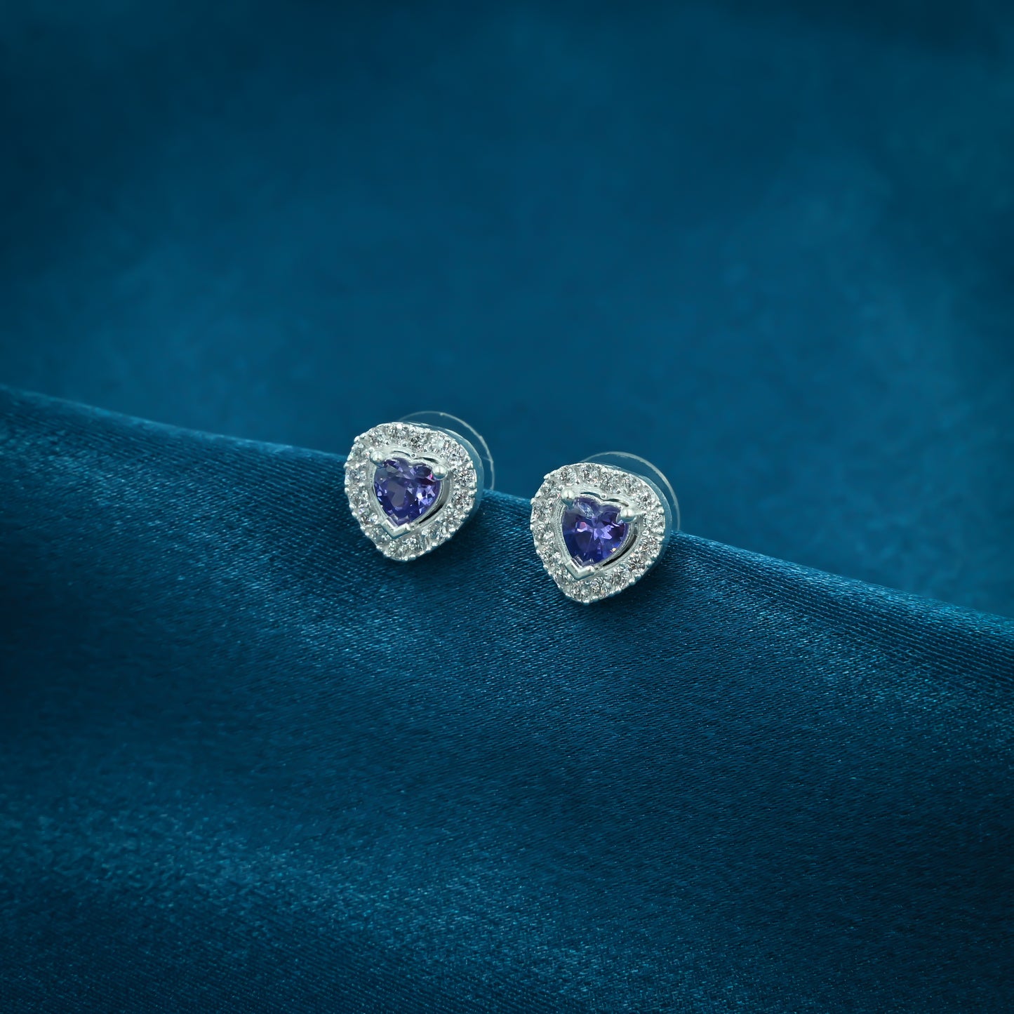 Sterling silver heart earrings adorned with ocean-colored stones