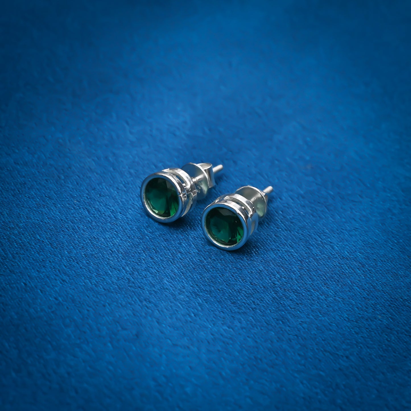 Charming round green stone earrings set in sterling silver