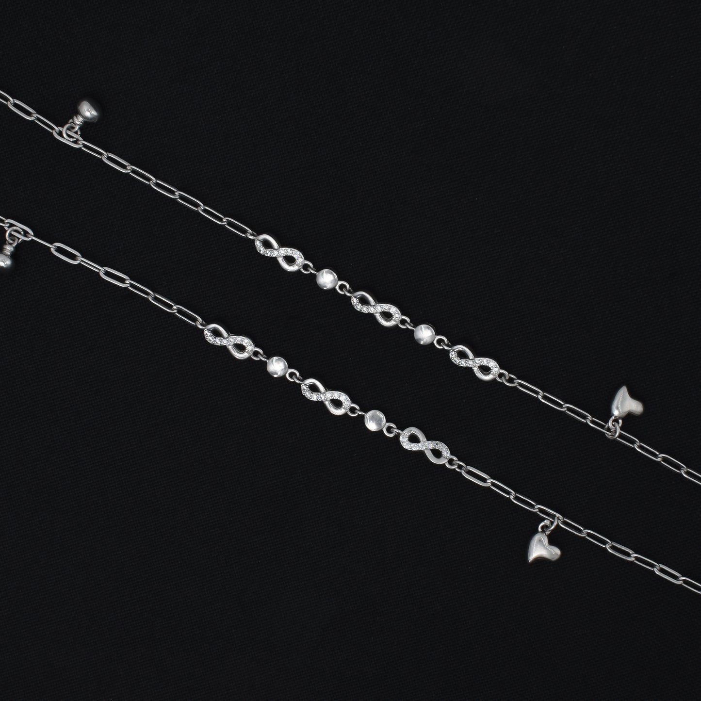 Delicate silver anklet featuring an infinity design, offering a timeless and fashionable addition to your jewelry collection