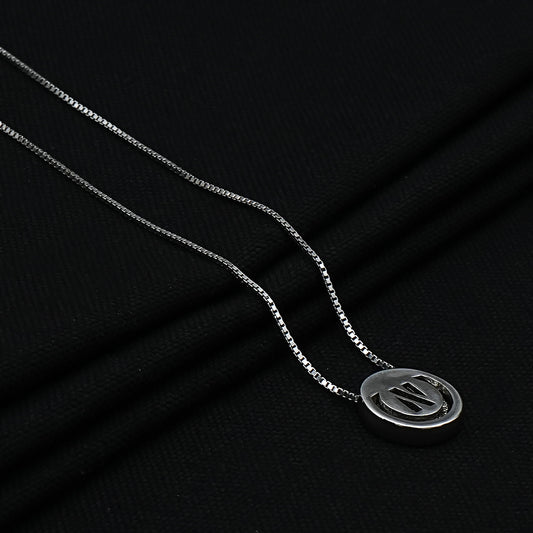 Elegant round pendant with 'N' on a sterling silver chain