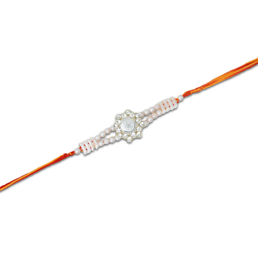 Boys' Rakhi featuring a silver Ganesh Ji centerpiece adorned with pearls.