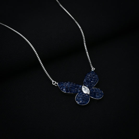 Delicate silver pendant featuring a butterfly design with a blue stone.